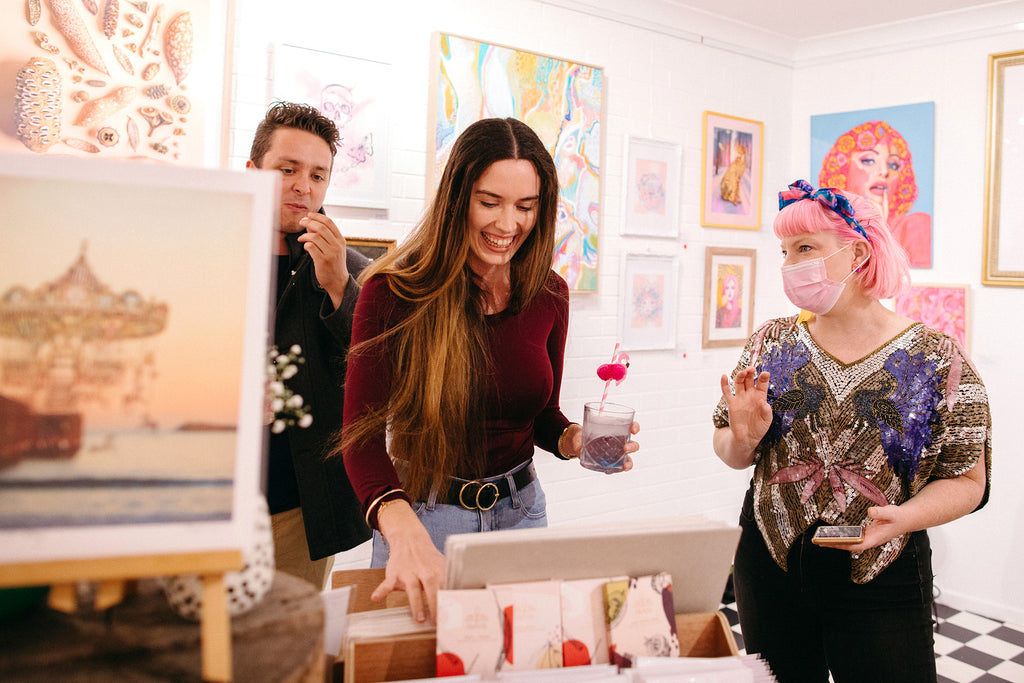 Inside the pink and whimsical art gallery and studio of Alykat Creative on the mid north coast of Coffs Harbour for their opening of the Fairy Floss Fantasy group art exhibition.