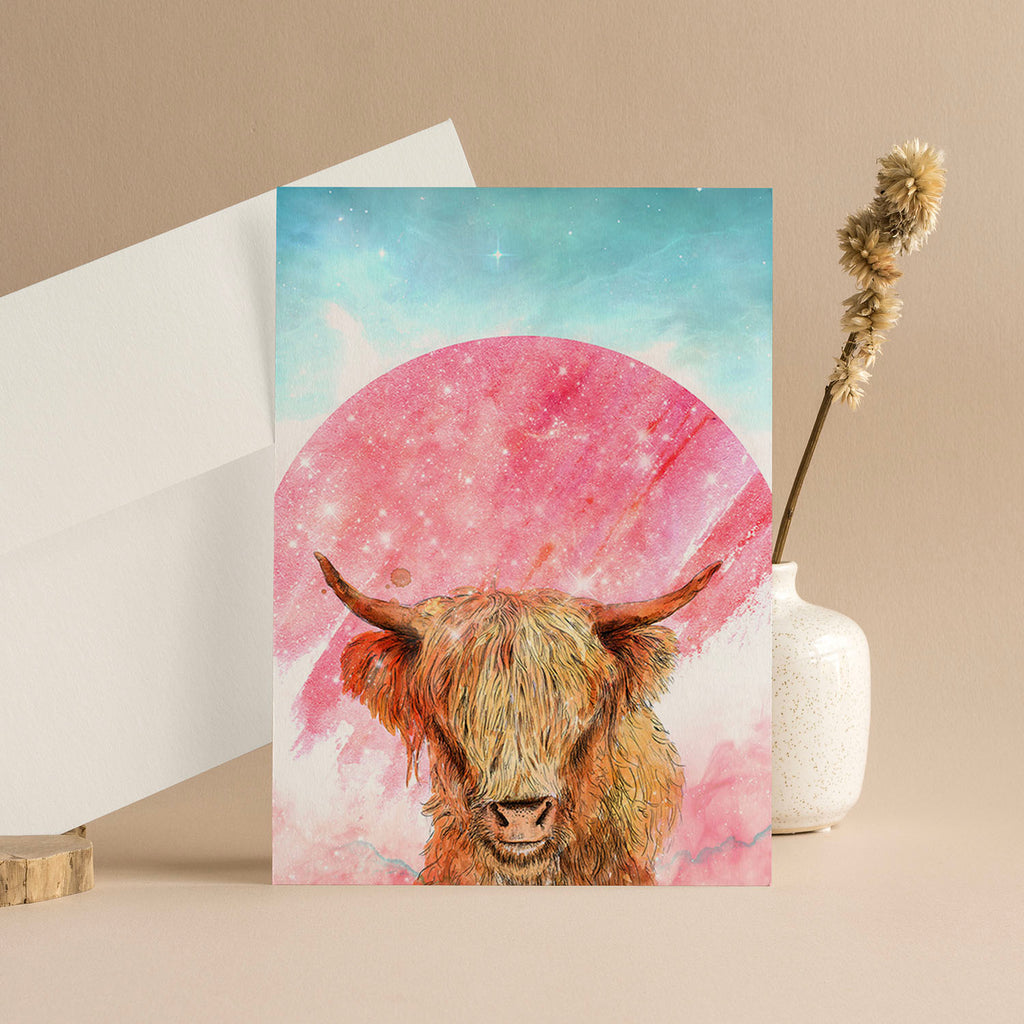 Illustrated highland cow with a colourful galactic background featuring the colours pink and blue.
