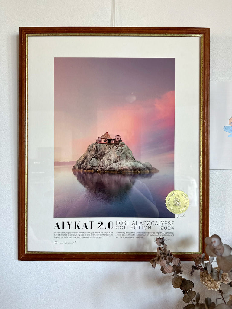 Framed poster of a scenic landscape with a circus on a rock, displayed on a wall.